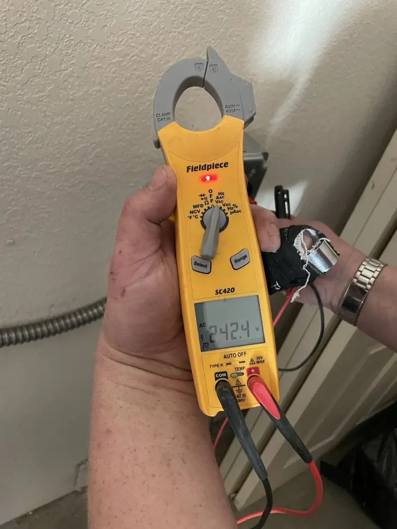Voltage testing with clamp meter during Generator Installation in Selma